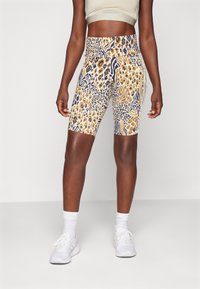 Leopardmönstrade cykelshorts med en åtsittande design, med hög midja och en mix av gult, svart och blått mönster. Tillverkade av stretchigt material.