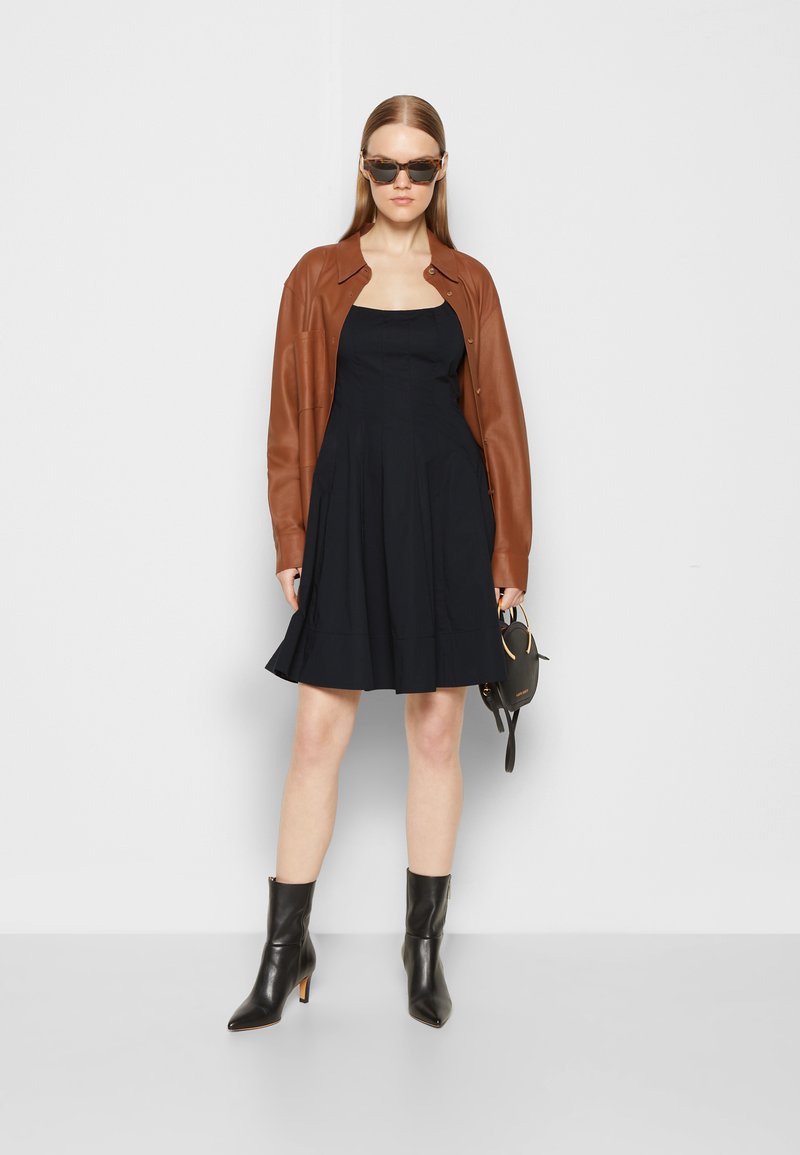 sanctuary leather dress Sanctuary Coated Denim Black Dress – Margo's and Co main image 1