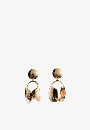 Gold-tone metal earrings with abstract, twisted open shapes hanging from textured round studs.