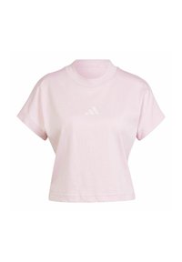 T-shirt rosa cropped in cotone, con scollo rotondo e maniche corte. Presenta un sottile logo Adidas bianco sul petto.