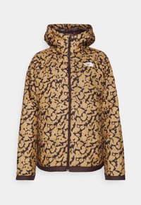 Veste à capuche marron et beige à motif camouflage avec fermeture éclair à l'avant et logo The North Face sur la poitrine gauche.