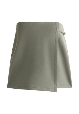 Gonna avvolgente khaki realizzata in un materiale liscio e leggero. Presenta una chiusura con fiocco laterale e una silhouette leggermente svasata.