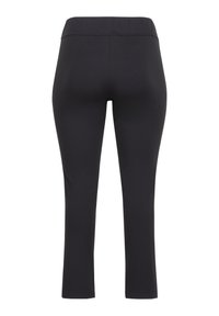 Zwarte legging met een aansluitend ontwerp, gemaakt van rekbare stof. Beschikt over een brede tailleband en een gladde textuur zonder zichtbare naden.