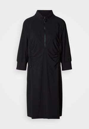 Black dress featuring a high collar, half-zip front, and tonal side ruching. Made of smooth fabric with gathered sleeves and accents.