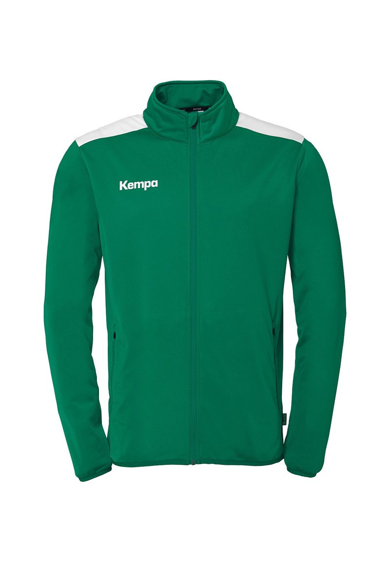 Groene jacket met witte schouderaccenten, volledige rits, hoge kraag en ritssluitingen aan de zijkant. Gemaakt van zacht, soepel materiaal. Met "Kempa"-logo.