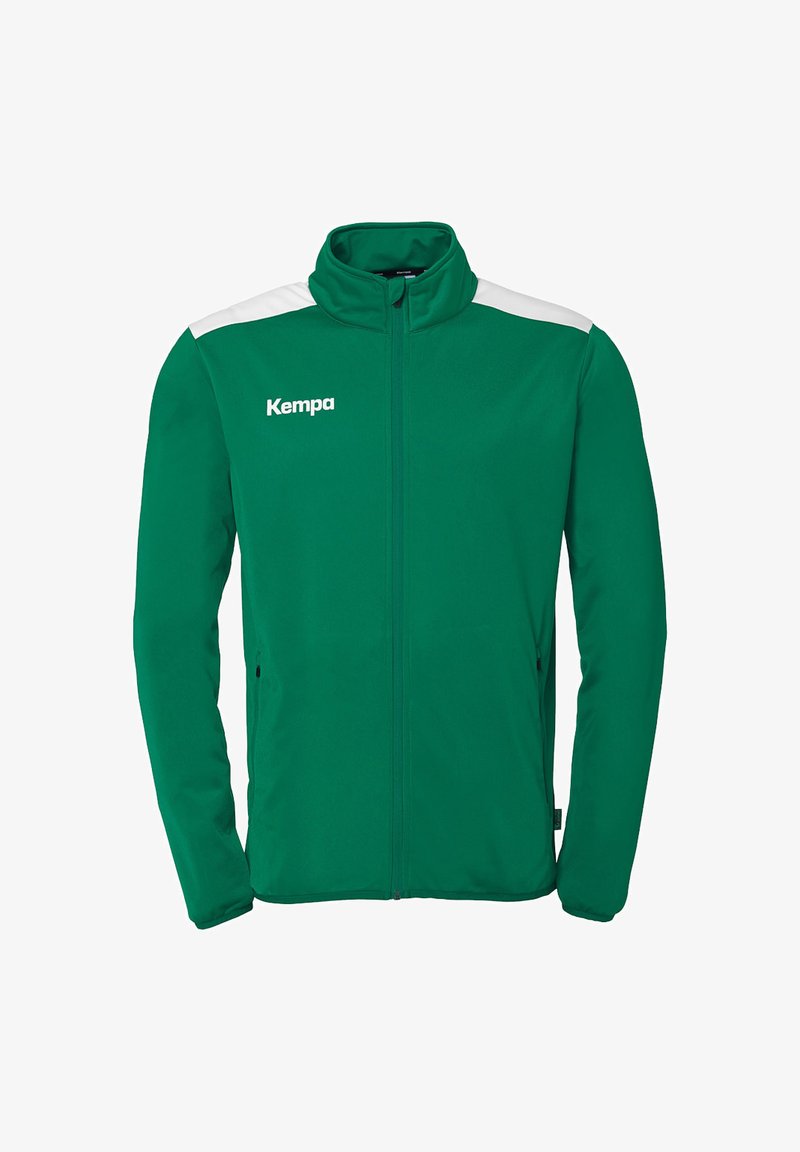 Groene jacket met witte schouderaccenten, volledige rits, hoge kraag en ritssluitingen aan de zijkant. Gemaakt van zacht, soepel materiaal. Met "Kempa"-logo.