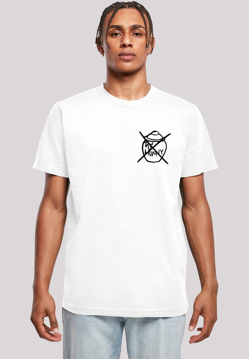 Hvit bomulls t-skjorte med et grafisk logo i svart som representerer en honningkrukke med et kors, korte ermer og rund hals.