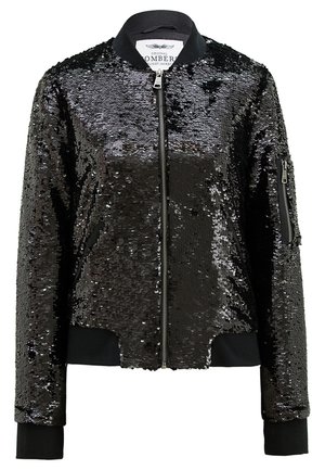 Schwarze Bomberjacke, die mit Pailletten bedeckt ist, mit einem Reißverschluss vorne, gerippten Bündchen und einem Kragen. Mit einer Reißverschlusstasche am Ärmel versehen.
