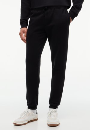 Tommy Jeans, TOMMY FLAG SLIM FLEECE DRAWSTRING JOGGERS - Долнище на анцуг - black