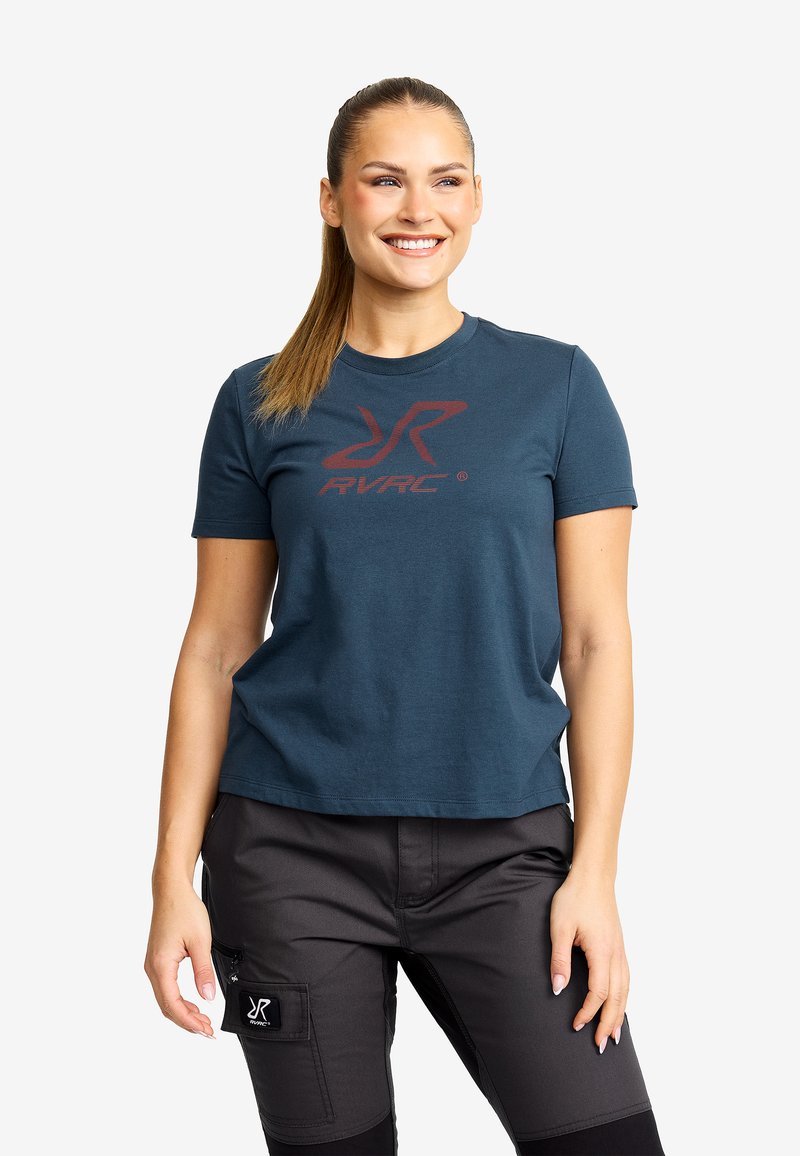 Dark teal short-sleeve t-shirt featuring a red logo on the front. Fabric appears soft with a crew neckline and a relaxed fit.