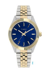Timex ur med blå skive, guldfarvede timemarkører og visere. Stålcase og et to-tonet guld- og sølvmetallestrop.