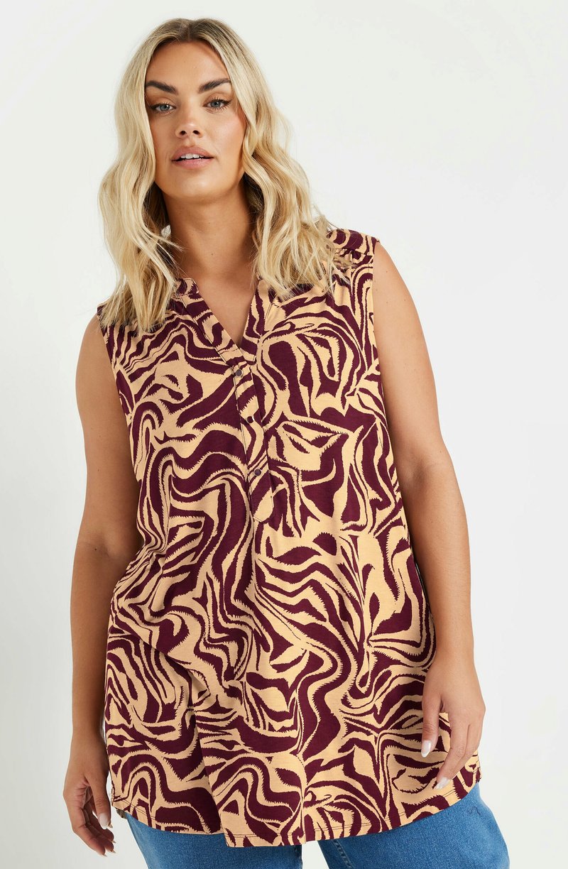 Mouwloze blouse met een beige en bordeauxrode golfpatroon. Voorzien van een kraag en knoopjes; gemaakt van lichtgewicht stof. Losse pasvorm.