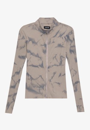 Ribbet zip-up top i lys grå med blå marmorering. Har en ståkrave og lange ærmer. Blød tekstur med tætsiddende design.