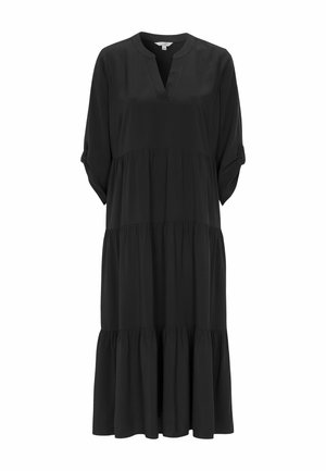 Musta, polvipituinen mekko pehmeästä kankaasta, jossa on V-kaula-aukko, lyhyet käännetyt hihat ja kerroksellinen röyhelöhelma. Yksinkertainen ja liehuva muotoilu.