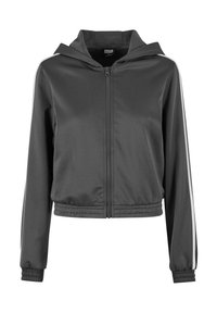 Cropped zip-up jacket in dark gray athletic fabric, featuring a hood, elastic cuffs, and white side stripes for added detail.