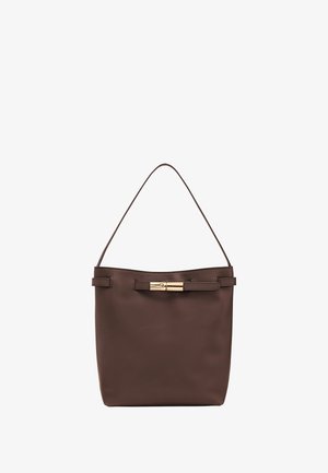 Brown leather bucket bag with a smooth texture, gold-tone hardware, and a simple design. Features a single shoulder strap and a clasp.