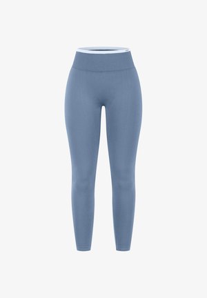 Blauwe, naadloze leggings met hoge taille en een brede geribde tailleband met witte bies op een effen witte achtergrond.