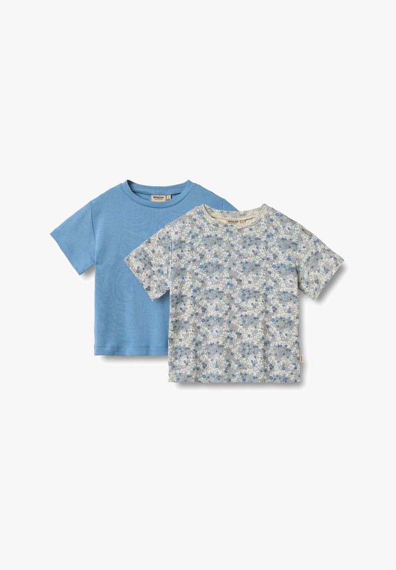 Two T-shirts: one solid light blue, the other with a floral pattern in light blue and white. Both have short sleeves and round necklines.