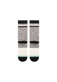 Grau und weiße Crew-Socken mit schwarzen Akzenten, die ein gestreiftes Muster oben und einen strukturierten cremefarbenen Bereich in der Nähe der Zehen aufweisen.