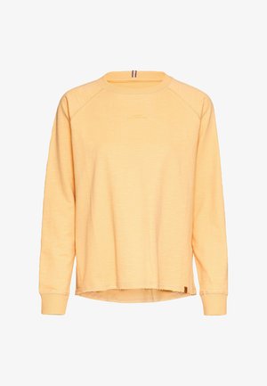 Lysgul sweatshirt lavet af blødt stof. Har en rund halsudskæring, lange raglanærmer og en let frynset kant. Minimal branding synlig.