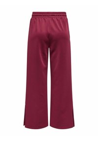 Pantaloni a vita alta di colore bordeaux, realizzati in tessuto liscio con una fascia elastica in vita e spacco laterale all'orlo. Design semplice e minimalista.