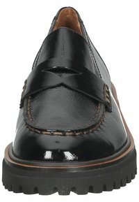 Black patent leather loafers with a decorative strap and brown stitching. Styled with a textured rubber sole for traction and durability.