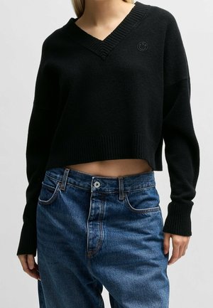 Stickad tröja - black