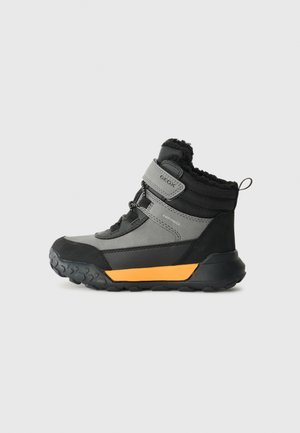 Gray and black ankle boots with a textured upper, orange accent on the sole, lace and Velcro fastening, and a wool-lined collar.
