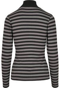 Langærmet top i sort og grå vandrette striber, med høj krave og en tætsiddende pasform. Blødt, strækbart stof med en glat tekstur.