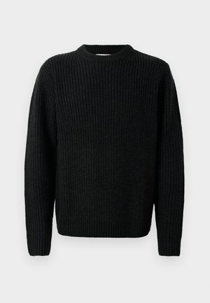 Suéter negro de punto con una textura acanalada, cuello redondo y mangas largas. Presenta un corte relajado con puños y dobladillo acanalados.