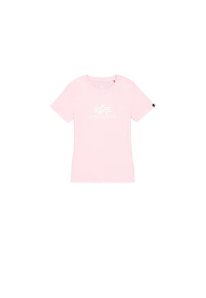 T-shirt rose à manches courtes en coton. Présente un logo blanc "ALPHA INDUSTRIES" avec des graphiques stylisés sur le devant. Encolure ronde.