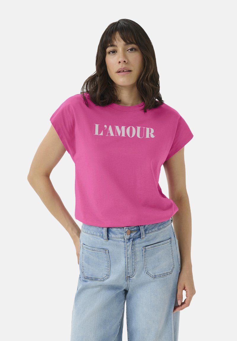 Pink cotton t-shirt with short sleeves, featuring the word "L'AMOUR" in white print across the front, paired with light blue jeans.