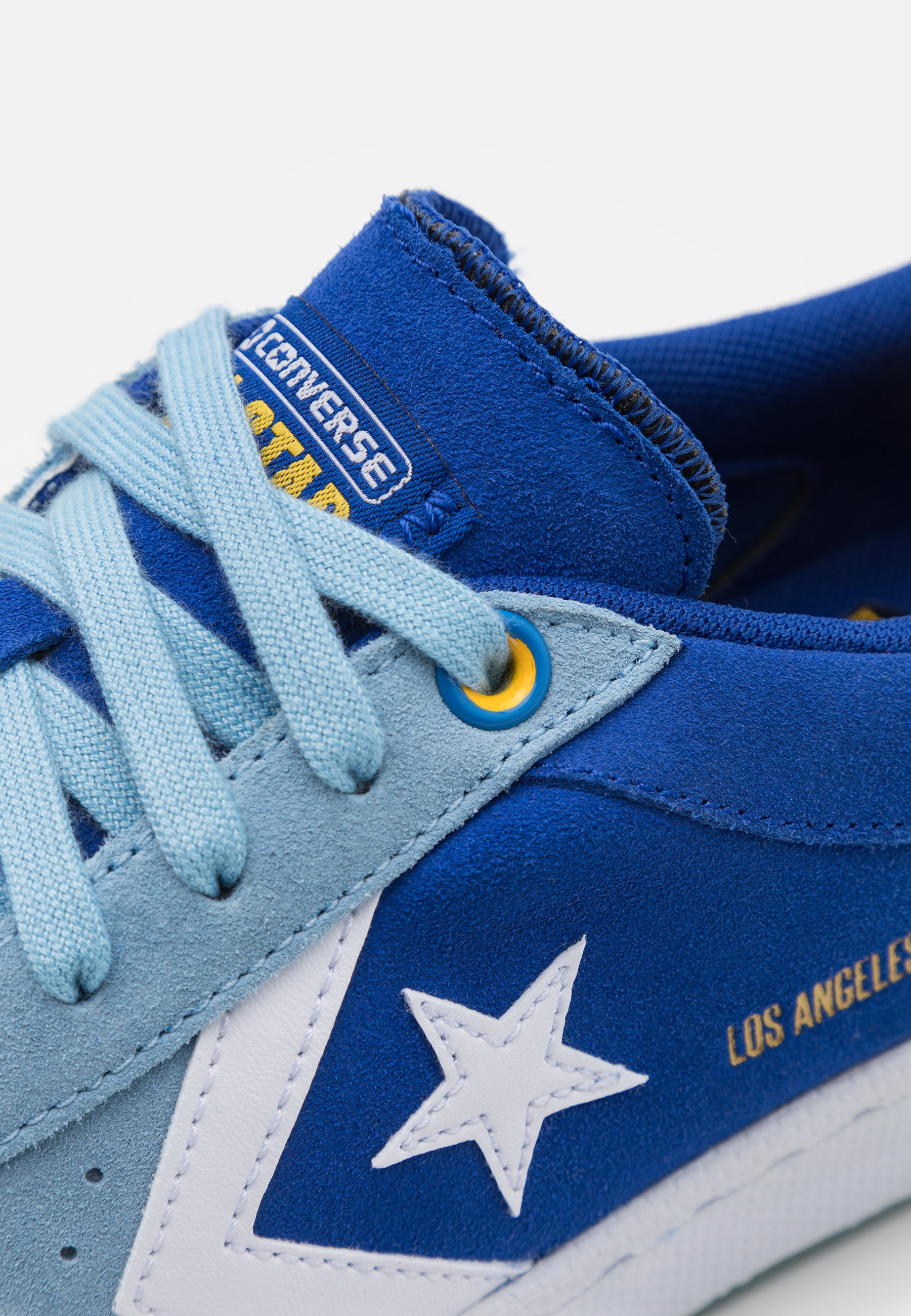 blue converse with heart