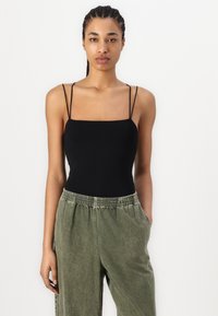 American Vintage UZATOWN - Calças de ganga de corte relaxado - olive