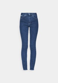 Slim fit jeans i blå denim, med en åtsittande design, medelhög midja och klassisk femficksstil med dragkedja.