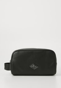 Black leather toiletry bag with a rectangular shape, featuring a textured surface, side handle, and a diamond-shaped logo patch.