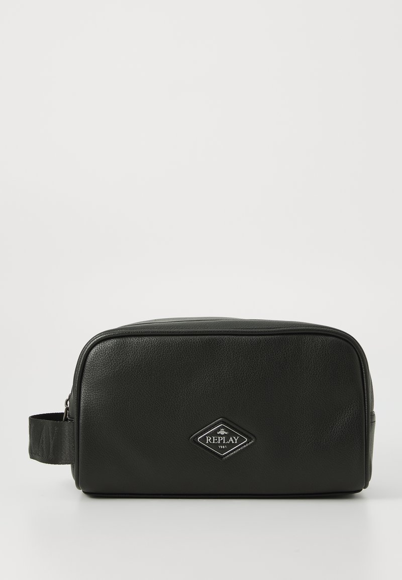 Black leather toiletry bag with a rectangular shape, featuring a textured surface, side handle, and a diamond-shaped logo patch.