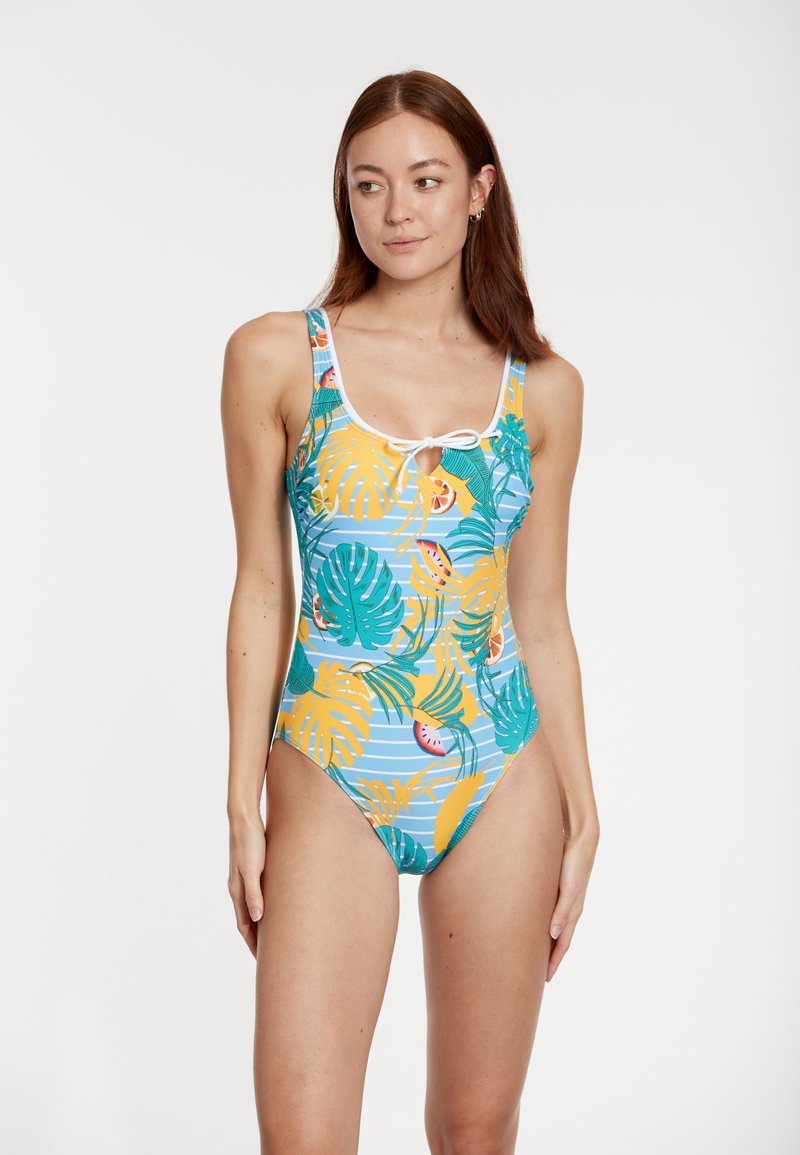 Maillot de bain une pièce avec un fond bleu orné de motifs de feuilles tropicales et de fruits en vert, jaune et rose ; détail de lien ajustable à l'avant.