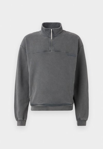 Gray, zip-up sweatshirt with a high collar, ribbed cuffs, and a relaxed fit. Features a tonal logo and textured fabric.