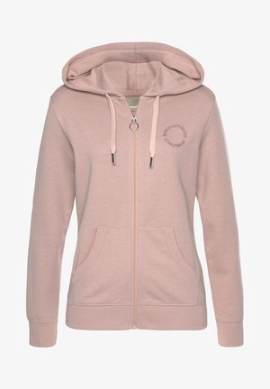 Light pink zip-up hoodie with a drawstring hood, front pockets, and logo embroidery. Made of soft fabric with ribbed cuffs and hem.