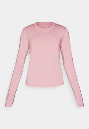 Long-sleeve pink athletic shirt made from smooth, lightweight fabric with a round neckline and subtle Nike logo on the chest.