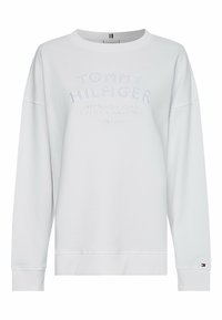 Felpa bianca con collo rotondo, con testo in rilievo "TOMMY HILFIGER", polsini e orlo a costine, e piccolo logo vicino al polsino. Materiale in morbido misto cotone.