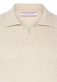 Beige knitted polo sweater with textured collar and V-neck opening, featuring a "Felix Hardy" size M label inside the neckline.