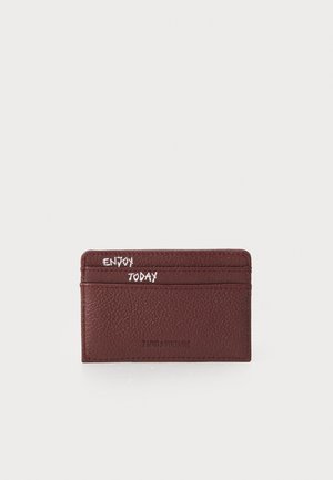Burgundy leather card holder featuring textured surface, four card slots, and printed text "ENJOY TODAY" in white on the front.