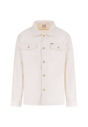 Ecrufarbene Hemdjacke mit langen Ärmeln, zwei vorderen Klappentaschen mit Knöpfen und einem kleinen Metall-Brandetikett auf der Brusttasche.