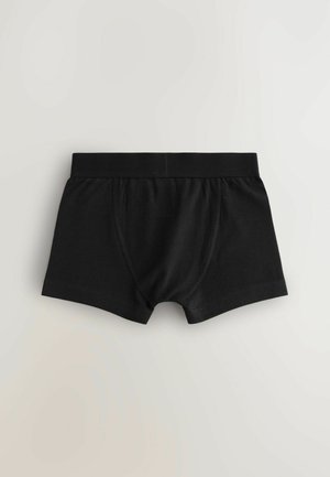 Boxeri scurți din bumbac negru, cu un tiv elastic moale, un buzunar frontal și o acoperire moderată a picioarelor. Textură netedă și design minim.