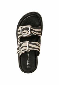 Sandale à enfiler avec imprimé zèbre noir et crème, dotée de deux boucles réglables, d'une semelle intérieure texturée et d'une semelle extérieure noire lisse. Taille 37.