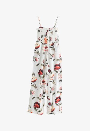 Witte mouwloze jumpsuit met brede pijpen, gerimpeld lijfje, knopen aan de voorkant en rood-roze bloemenprint met groene bladeren.
