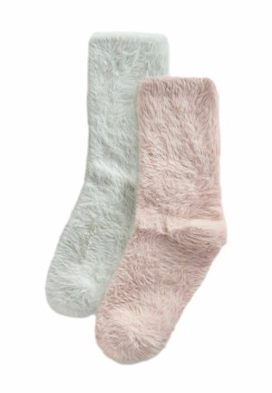Mysiga strumpor i ljusgrön och blushrosa, med mjukt, texturerat material och en ribbad mudd för extra komfort.