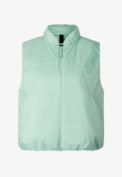 Lysegrøn ermeløs dynevest med lynlås foran og opretstående krave, designet til varme og afslappet brug.